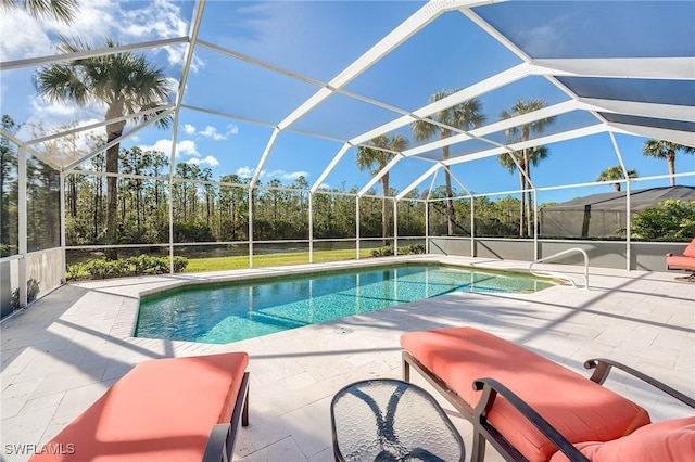 view of pool with a lanai and a patio