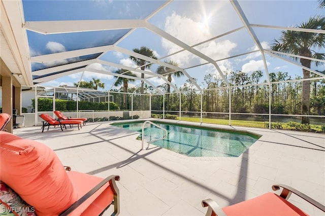 view of pool with a lanai and a patio area