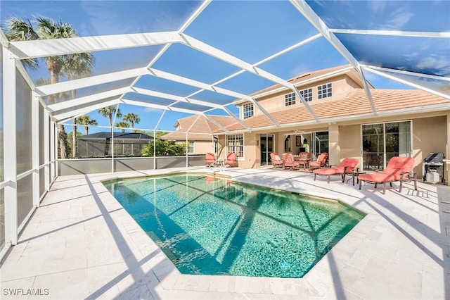 view of pool featuring a patio area and a lanai