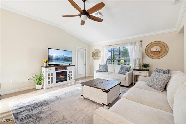 20680 Vita Ct, Venice, FL 34293 - tiled living room featuring a ceiling fan, ornamental molding, lofted ceiling, and a glass covered fireplace