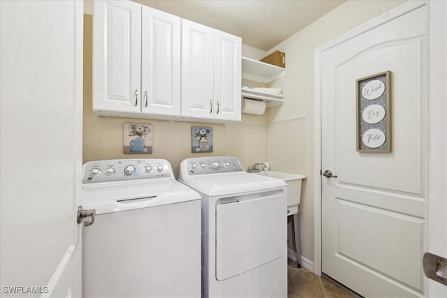 20680 Vita Ct, Venice, FL 34293 - laundry room with cabinet space, separate washer and dryer, and tile patterned flooring