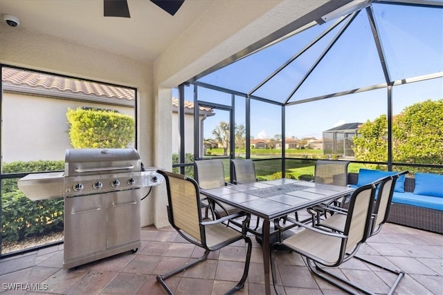 20680 Vita Ct, Venice, FL 34293 - view of patio / terrace featuring grilling area, outdoor dining area, glass enclosure, and a residential view