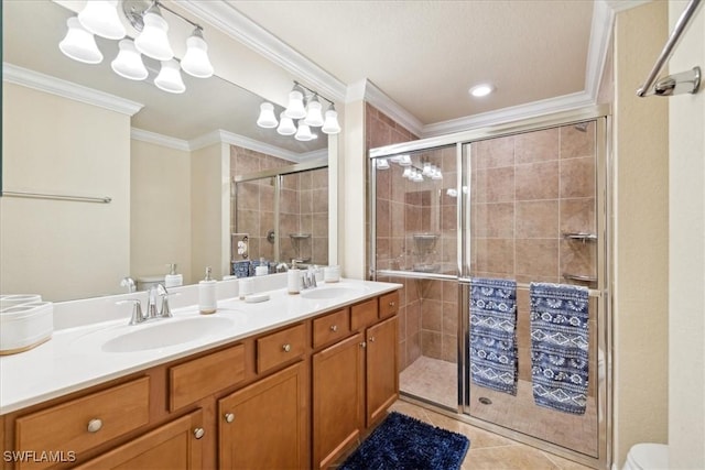 20680 Vita Ct, Venice, FL 34293 - full bath featuring double vanity, crown molding, a stall shower, and tile patterned flooring