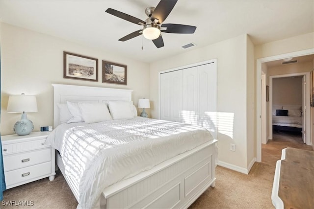 20680 Vita Ct, Venice, FL 34293 - bedroom featuring light carpet, a closet, and ceiling fan