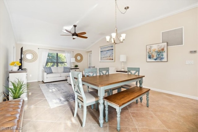 20680 Vita Ct, Venice, FL 34293 - dining space featuring light tile patterned flooring, crown molding, a chandelier, ceiling fan, and vaulted ceiling