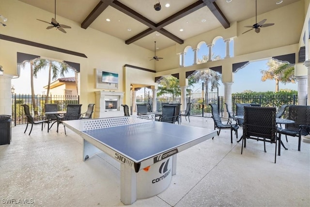 20680 Vita Ct, Venice, FL 34293 - playroom featuring ceiling fan, beamed ceiling, coffered ceiling, plenty of natural light, and a towering ceiling