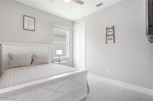 bedroom with carpet flooring, ceiling fan, and a closet