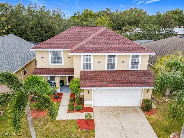 view of front of property with a porch and a garage