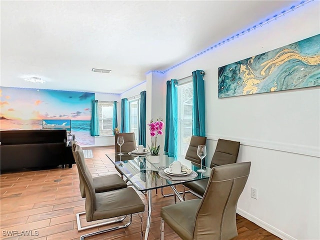 dining space featuring light hardwood / wood-style flooring