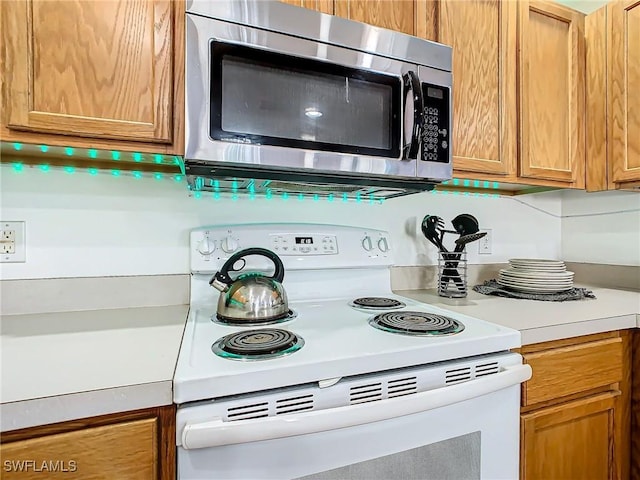 kitchen featuring white range with electric cooktop