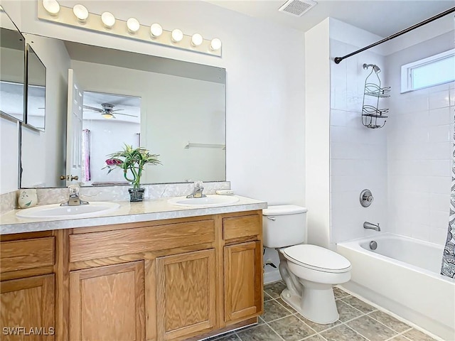 full bathroom featuring ceiling fan, shower / bathtub combination with curtain, tile patterned floors, toilet, and vanity