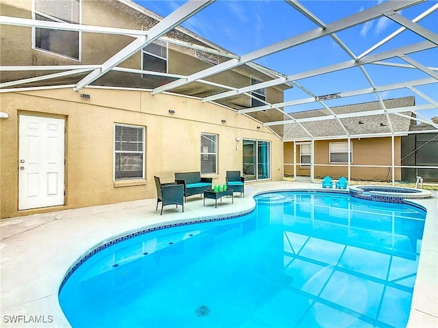 view of pool featuring a lanai, an in ground hot tub, and a patio