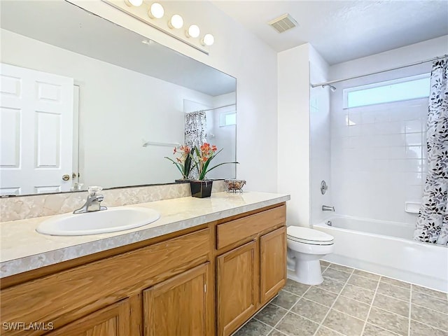 full bathroom with tile patterned flooring, vanity, toilet, and shower / tub combo with curtain