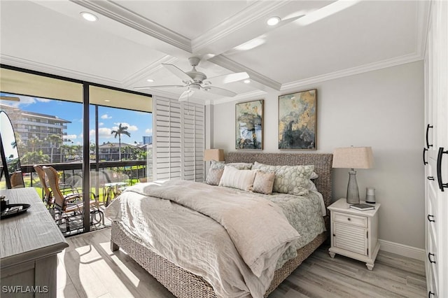 bedroom featuring access to outside, ceiling fan, light wood-type flooring, ornamental molding, and beamed ceiling