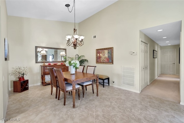 dining room featuring a notable chandelier and light tile patterned floors