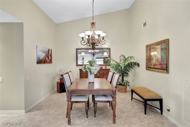 dining space featuring a chandelier, visible vents, and baseboards