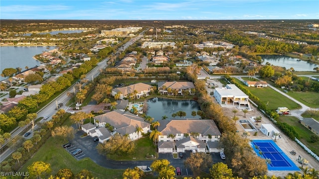 birds eye view of property featuring a water view and a residential view