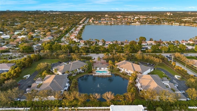 bird's eye view featuring a water view and a residential view