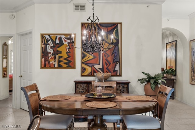 dining space with light tile patterned floors, visible vents, and ornamental molding