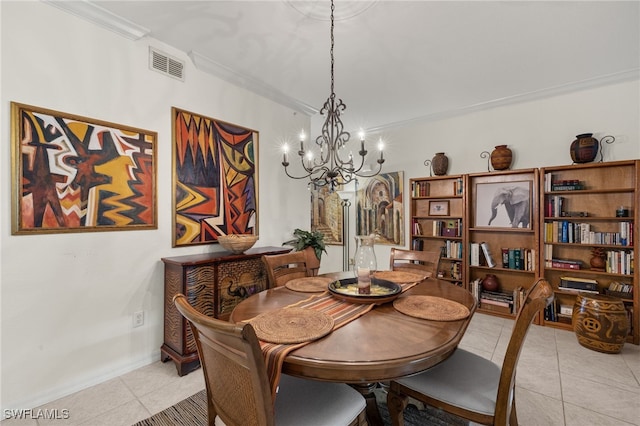 dining space with ornamental molding, light tile patterned flooring, visible vents, and an inviting chandelier