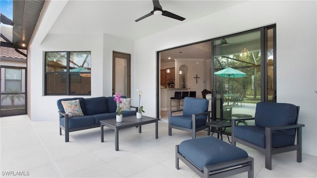 view of patio featuring an outdoor living space and ceiling fan