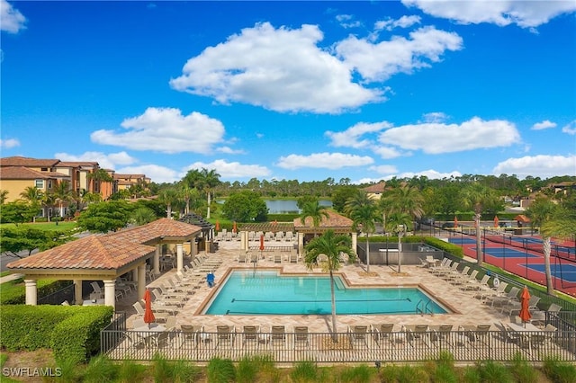 view of pool with tennis court