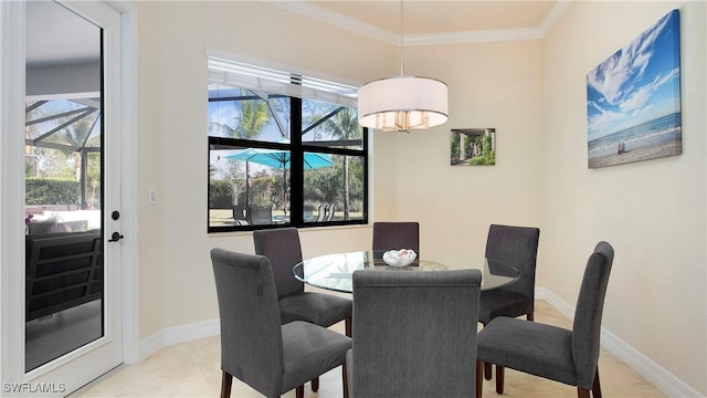 dining space featuring plenty of natural light and crown molding