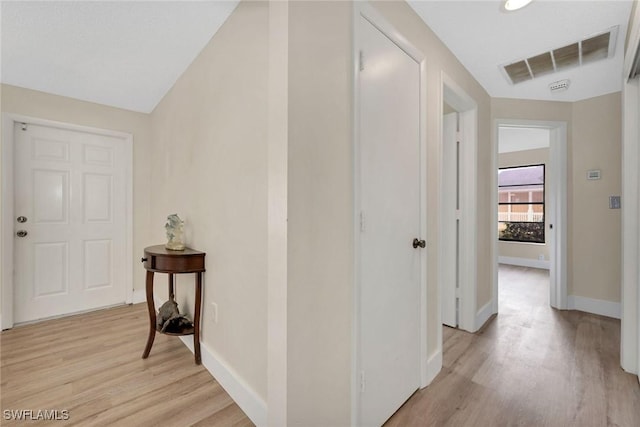 corridor featuring light hardwood / wood-style flooring