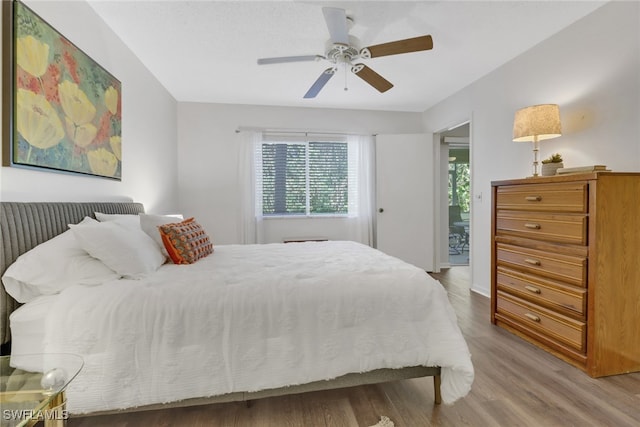 bedroom with hardwood / wood-style flooring and ceiling fan