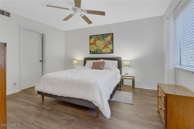 bedroom featuring ceiling fan and hardwood / wood-style floors