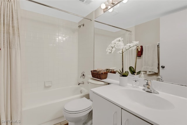 full bathroom with vanity, shower / tub combo, and toilet