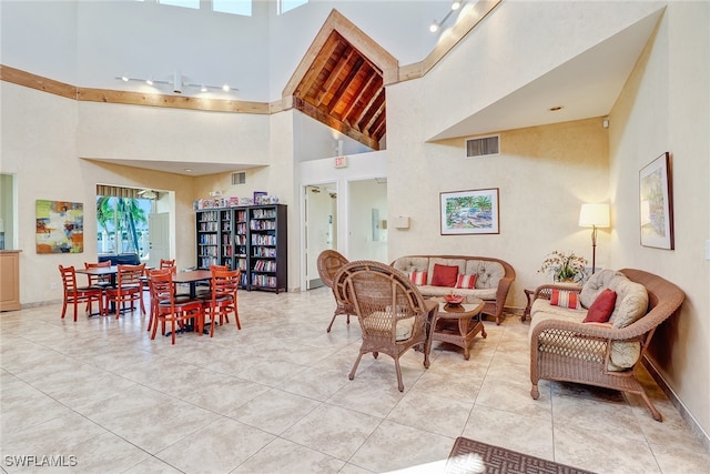 living room with a towering ceiling