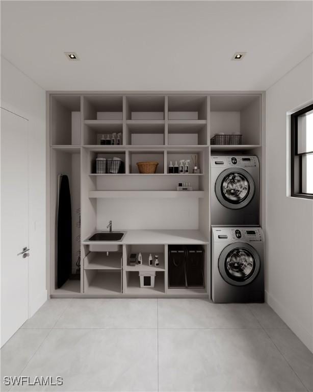 clothes washing area with stacked washer / dryer and sink