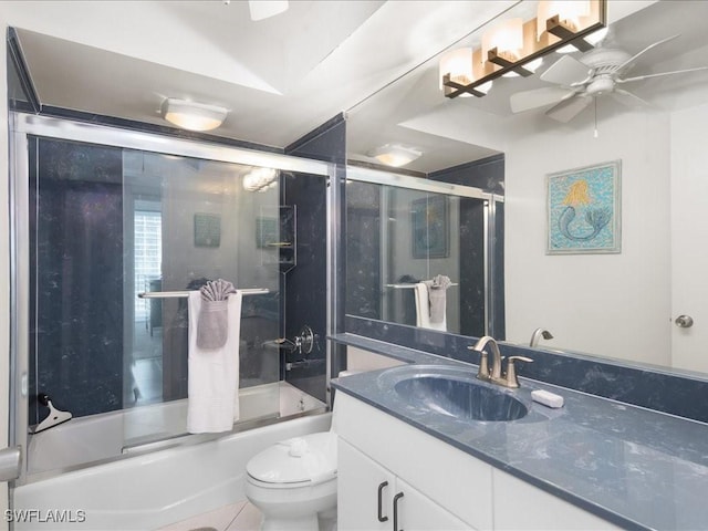 full bathroom with tile patterned floors, vanity, ceiling fan, shower / bath combination with glass door, and toilet