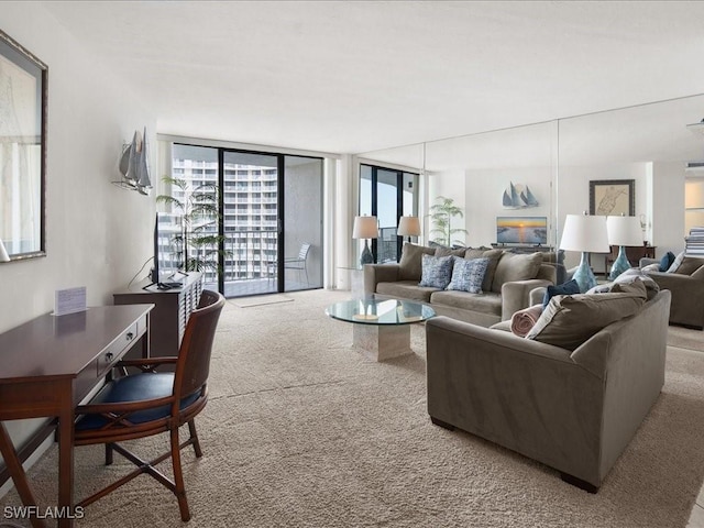 carpeted living room featuring floor to ceiling windows