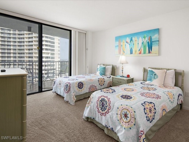 bedroom with access to outside, floor to ceiling windows, and carpet