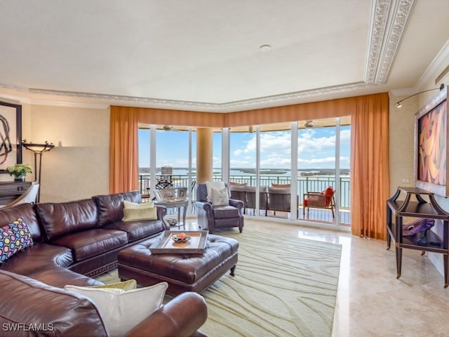 living room featuring a water view and ornamental molding