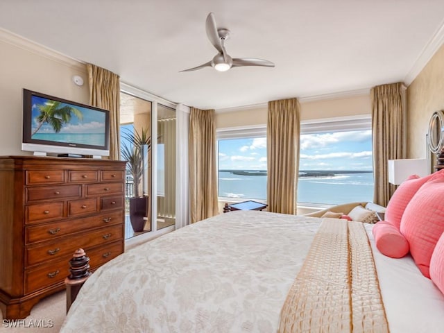 bedroom with access to outside, ceiling fan, a water view, and ornamental molding