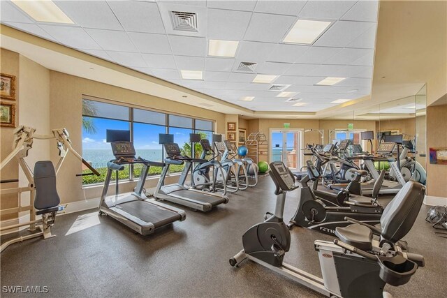 workout area featuring a drop ceiling