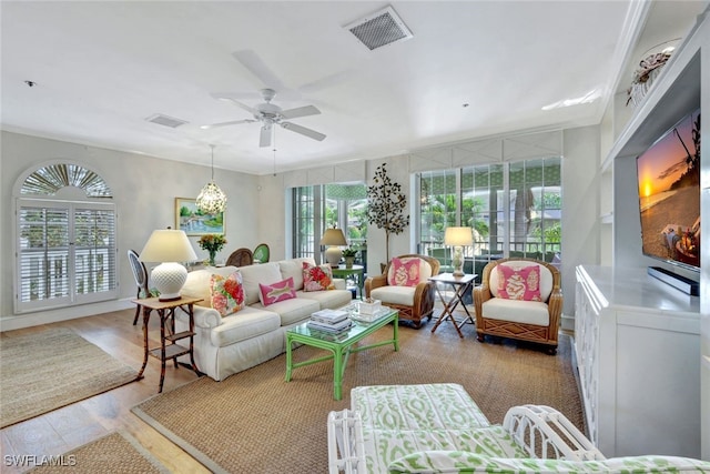 living room featuring ceiling fan and light hardwood / wood-style floors