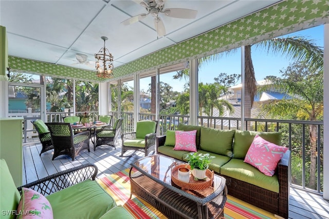 sunroom with ceiling fan and a wealth of natural light