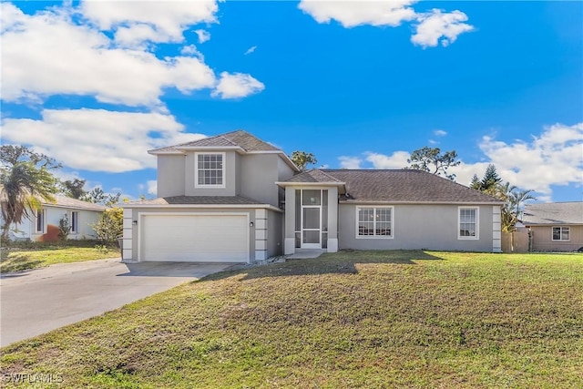 view of front of property featuring a front lawn and a garage