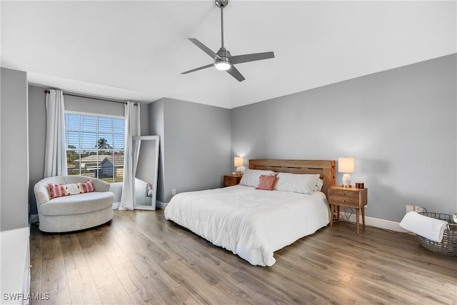 bedroom featuring hardwood / wood-style flooring and ceiling fan