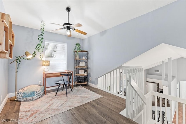 office with ceiling fan and dark hardwood / wood-style floors