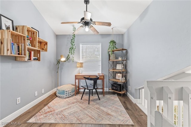 office space featuring ceiling fan, dark wood-type flooring, and lofted ceiling