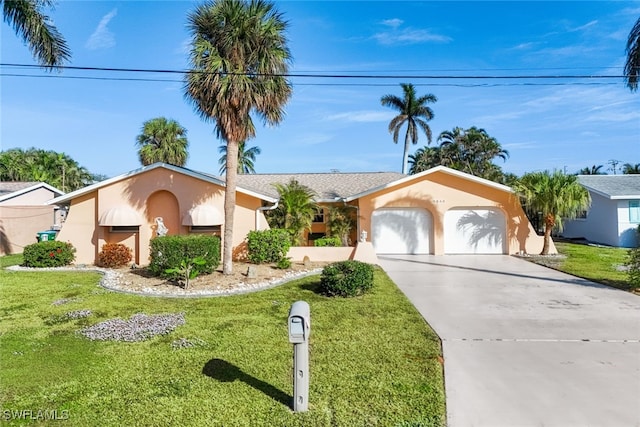 single story home with a garage and a front yard