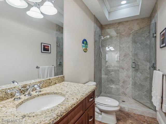 bathroom featuring crown molding, toilet, vanity, and walk in shower