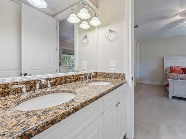 bathroom featuring crown molding, vanity, and ceiling fan with notable chandelier