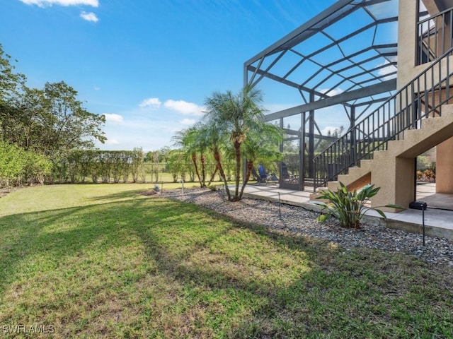 view of yard with a lanai