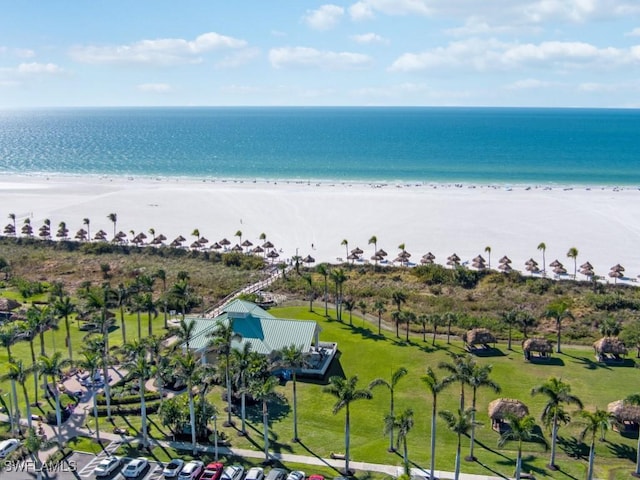 bird's eye view with a water view and a beach view